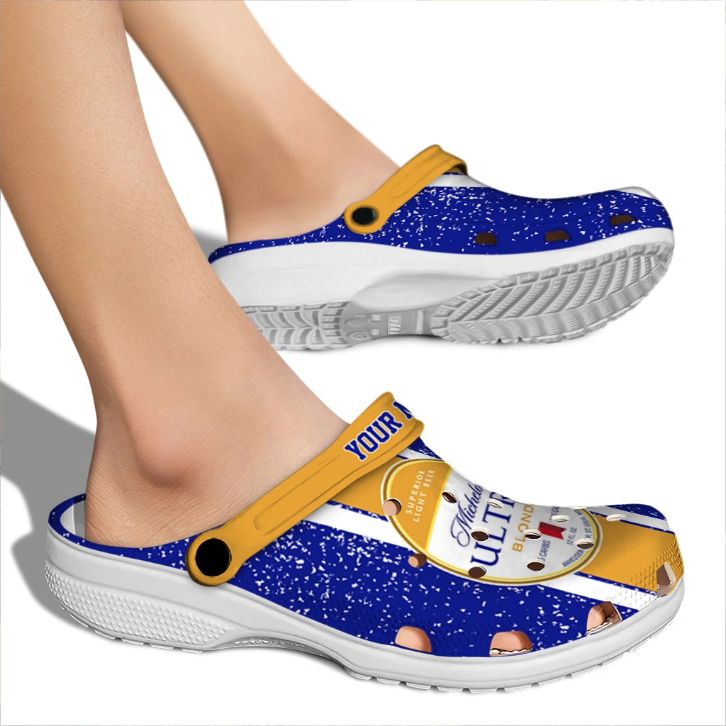 customized-michelob-ultra-brand-crest-blue-yellow-clogs-fashion-forward-hey-clogs.webp