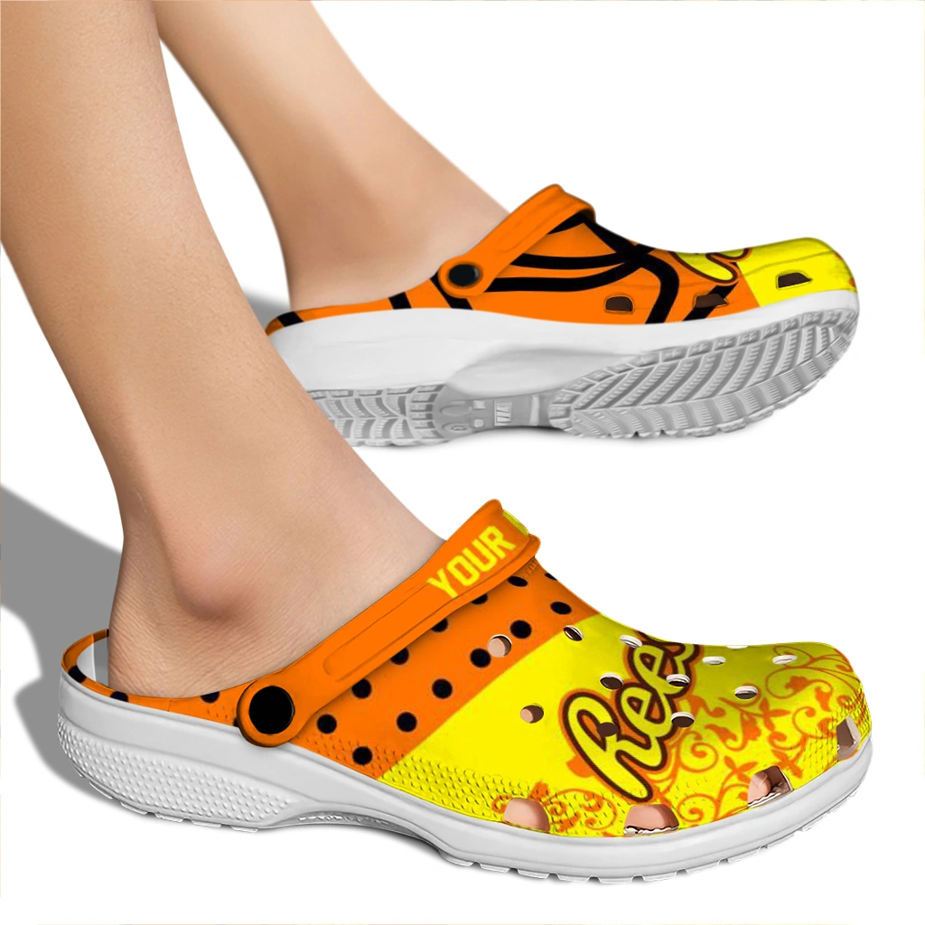 customized-reeses-orange-motif-orange-yellow-clogs-fashion-forward-hey-clogs.webp