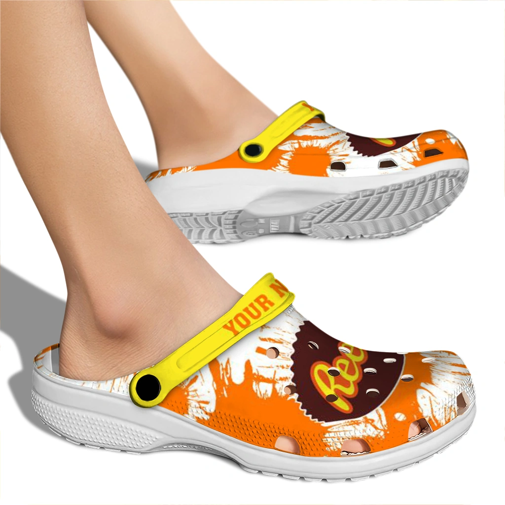 personalized-reeses-orange-splat-orange-yellow-clogs-fashion-forward-hey-clogs.webp